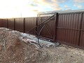 Откатные ворота из металлического штакетника - фото