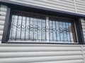 Кованая решетка балконная с витыми элементами - фото